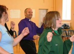 Bishop Abernethy joins in the dancing with children and leaders in Holy Trinity Parish Church Hall, north Belfast.